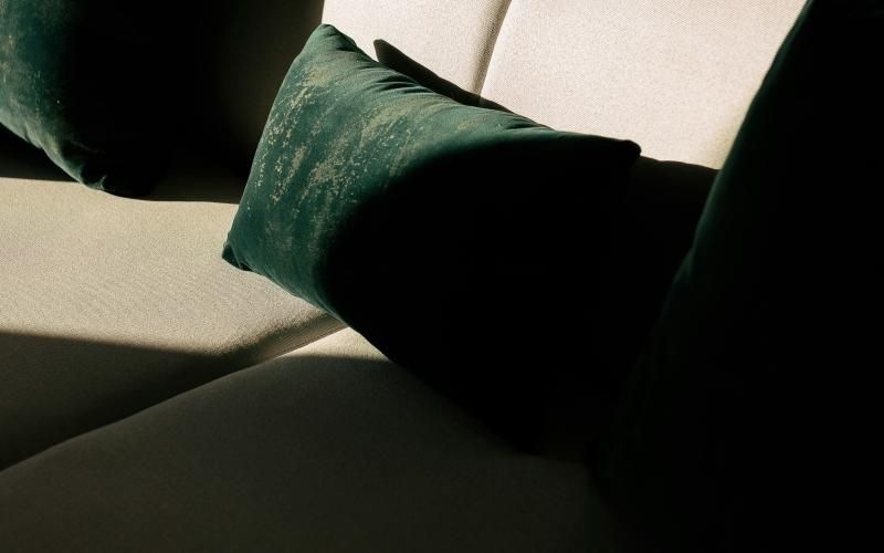 a person's legs and pillows